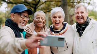 friends smiling and taking a selfie