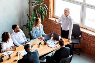 person leading a discussion in a team meeting