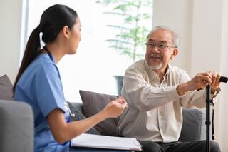 nurse explaining notes to female patient